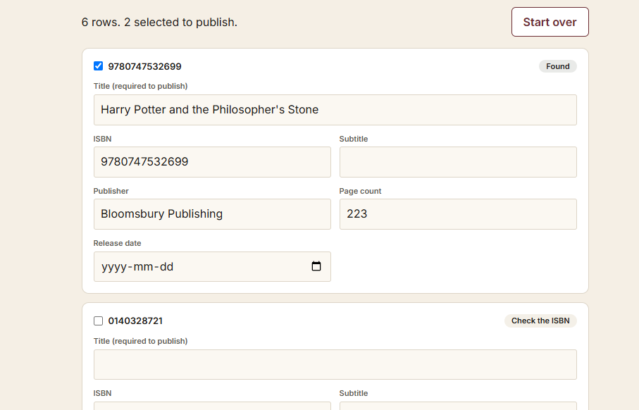 The review table with one card per ISBN, fields prefilled, and status chips.